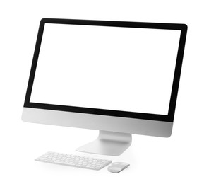 Photo of Computer monitor, keyboard and mouse isolated on white