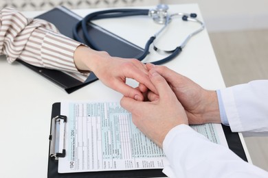 Photo of Dependent woman having appointment with addiction specialist in clinic, closeup