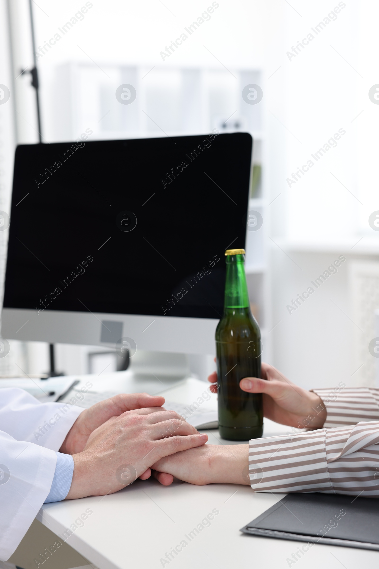 Photo of Alcoholic woman having appointment with healthcare specialist in clinic, closeup. Addiction treatment