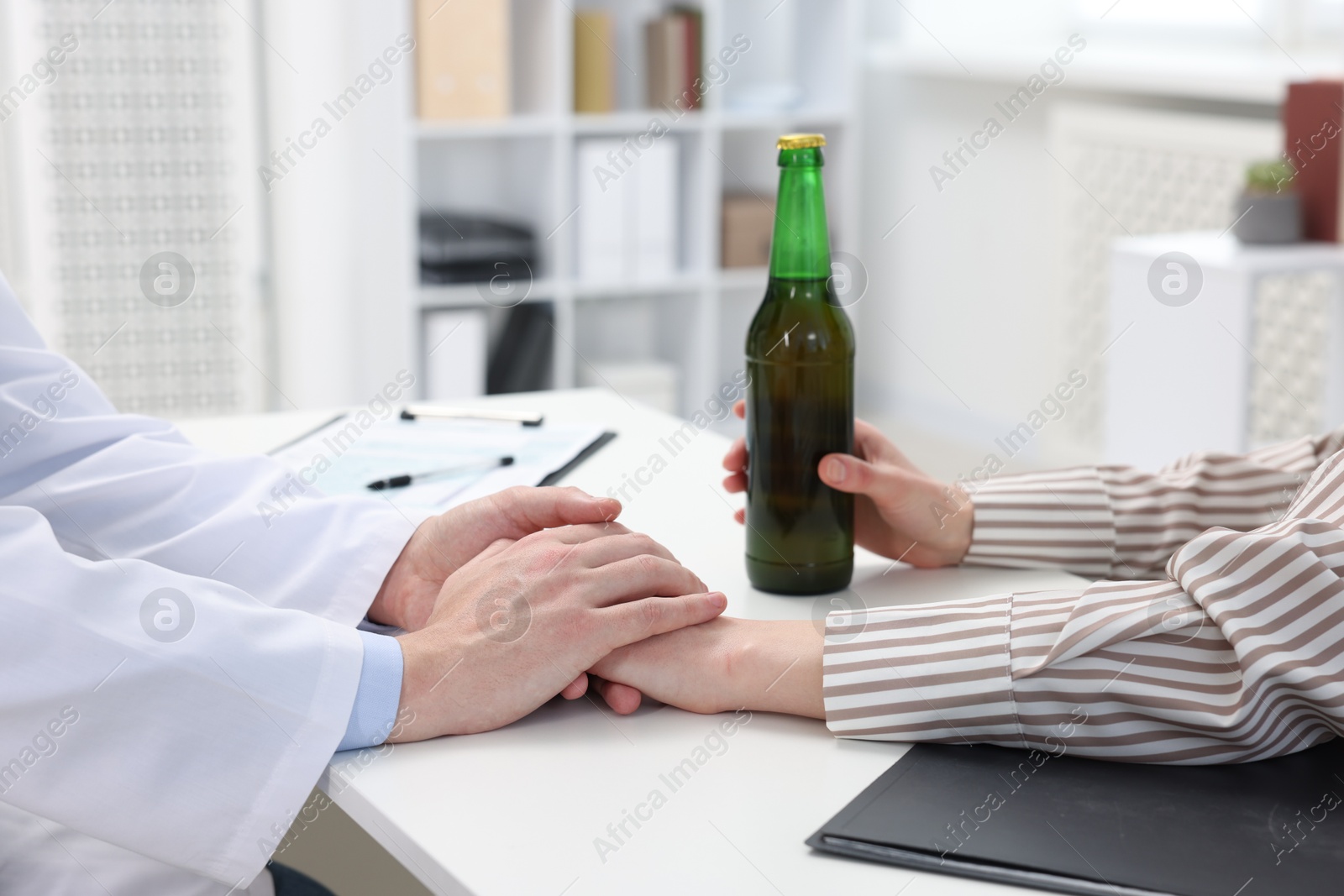 Photo of Alcoholic woman having appointment with healthcare specialist in clinic, closeup. Addiction treatment