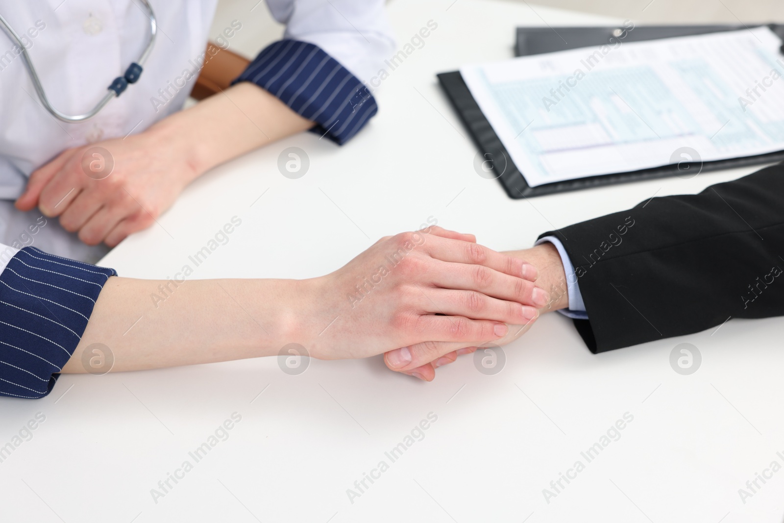 Photo of Dependent man having appointment with addiction specialist in clinic, closeup