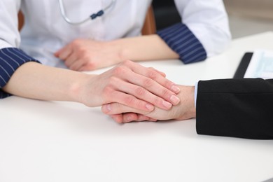 Photo of Dependent man having appointment with addiction specialist in clinic, closeup