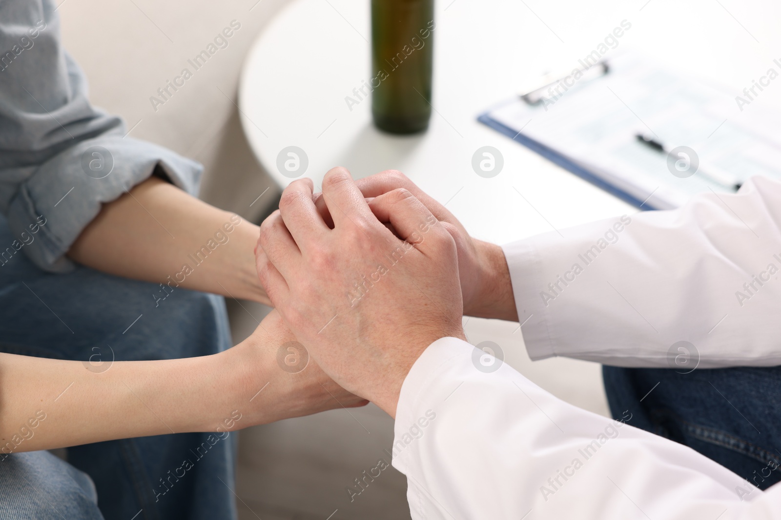 Photo of Dependent woman having appointment with addiction specialist in clinic, closeup