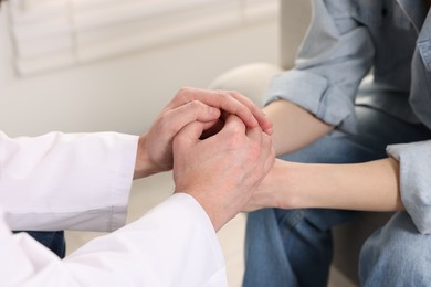 Photo of Dependent woman having appointment with addiction specialist in clinic, closeup