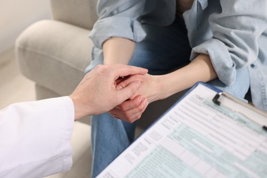 Photo of Dependent woman having appointment with addiction specialist in clinic, closeup