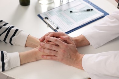 Photo of Dependent woman having appointment with addiction specialist in clinic, closeup