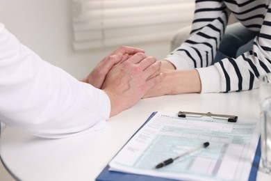 Photo of Dependent woman having appointment with addiction specialist in clinic, closeup