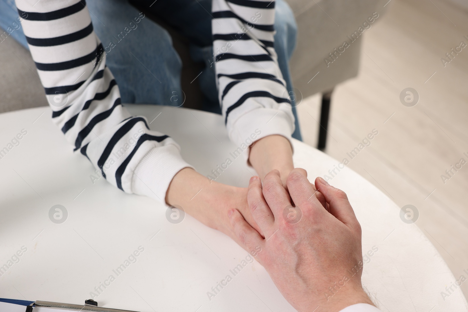 Photo of Dependent woman having appointment with addiction specialist in clinic, closeup