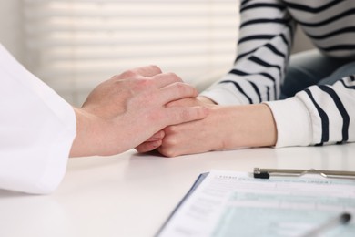 Photo of Dependent woman having appointment with addiction specialist in clinic, closeup