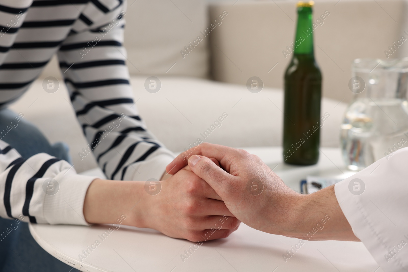 Photo of Dependent woman having appointment with addiction specialist in clinic, closeup