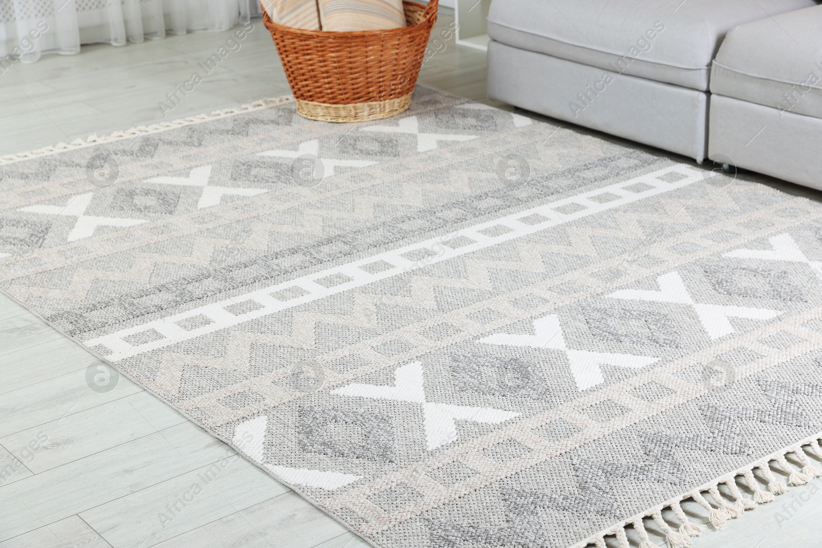 Stylish soft rug with pattern on floor in living room Photo of Stylish soft rug with pattern on floor in living room
