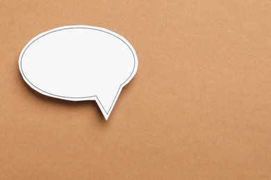 Photo of Blank speech bubble on brown background. Space for text