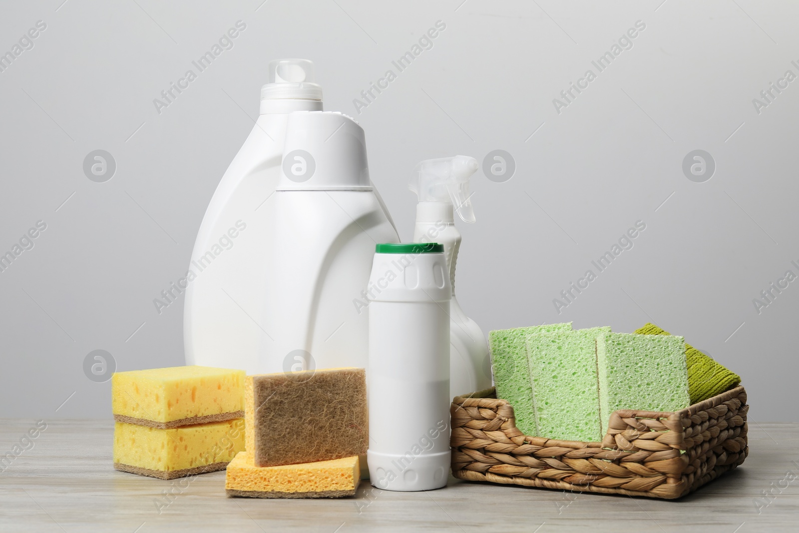 Photo of Eco-friendly cleaning products and supplies on wooden table