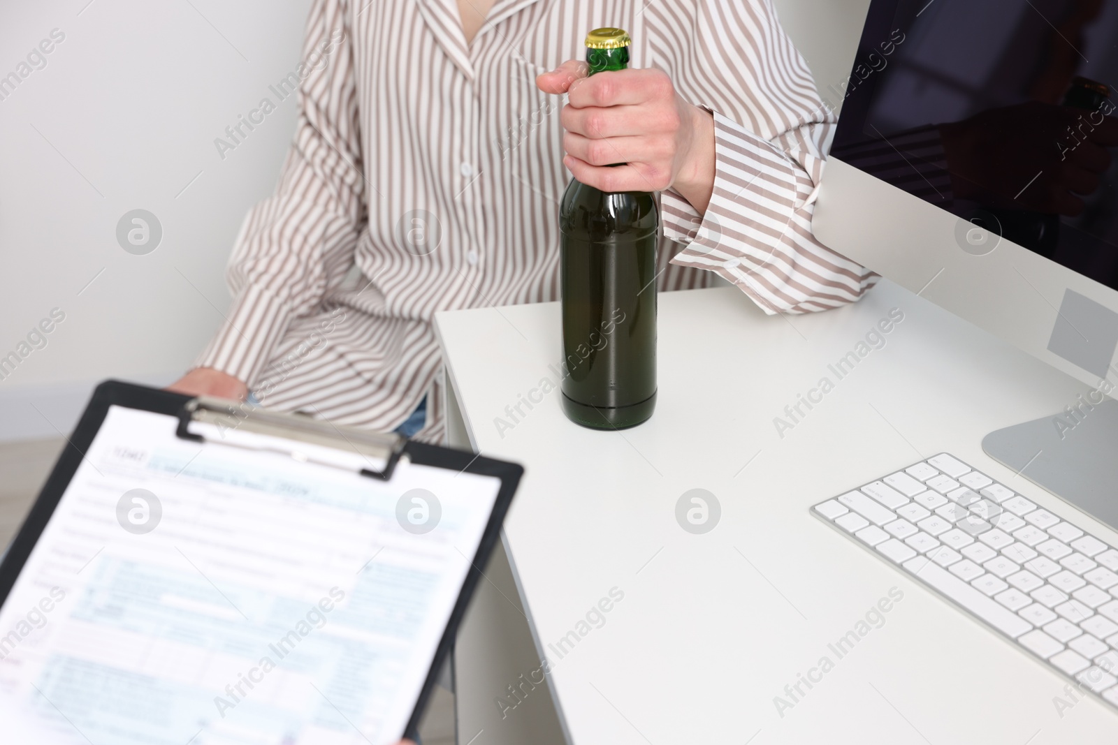 Photo of Alcoholic woman having appointment with healthcare specialist in clinic, closeup. Addiction treatment