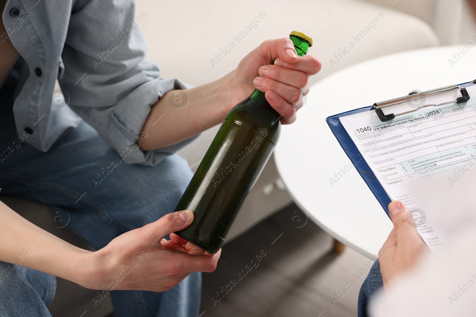 Photo of Alcoholic woman having appointment with healthcare specialist in clinic, closeup. Addiction treatment