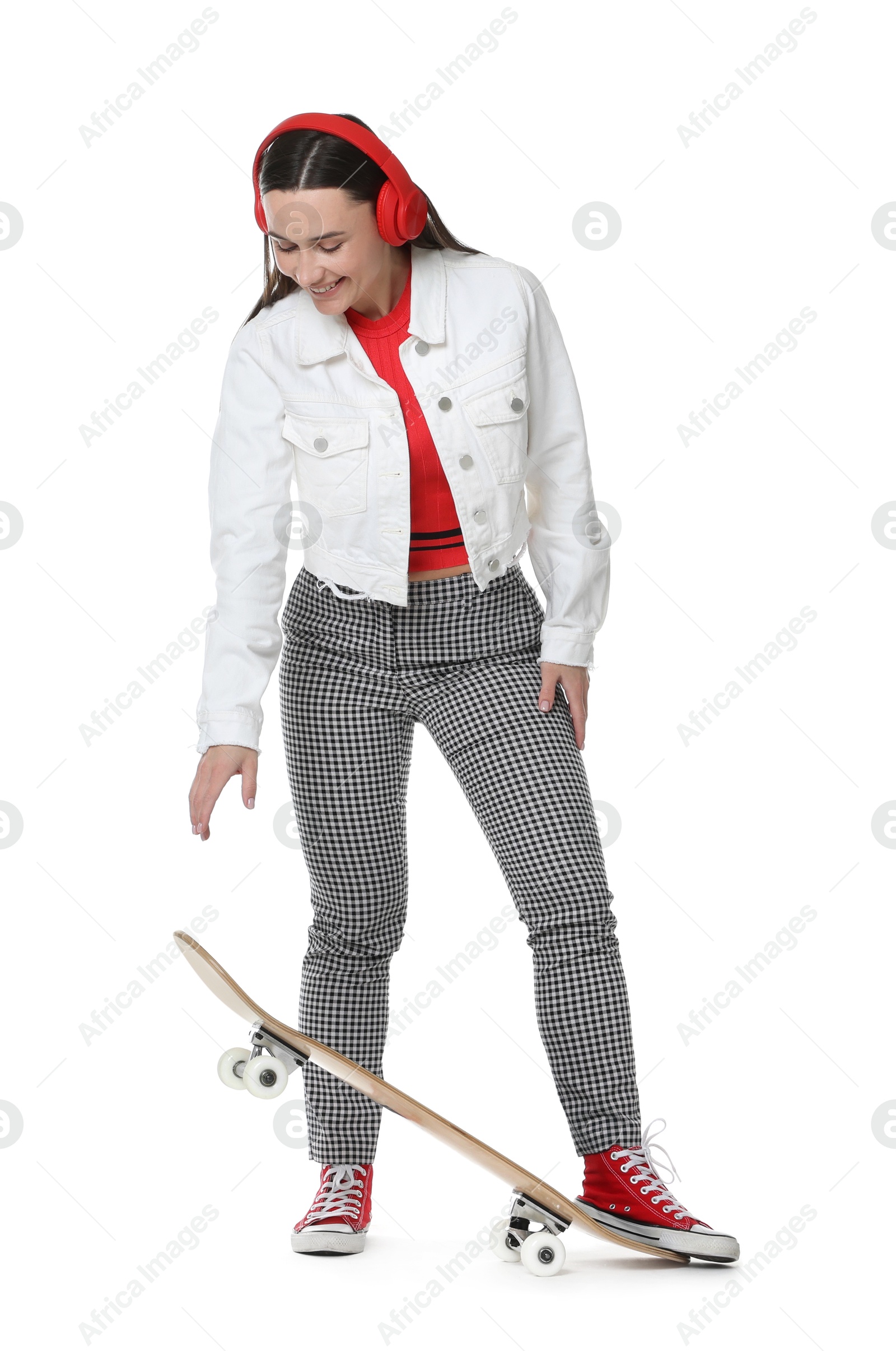 Photo of Smiling woman with skateboard on white background