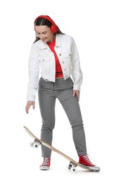 Photo of Smiling woman with skateboard on white background