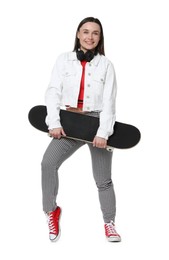 Photo of Smiling woman with skateboard on white background