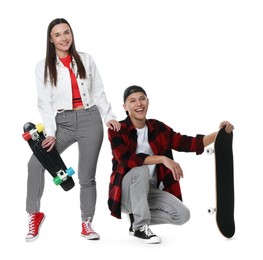 Photo of Happy friends with skateboards on white background