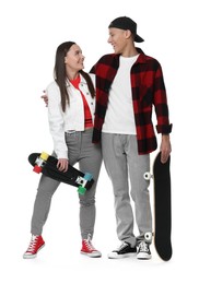 Photo of Happy friends with skateboards on white background