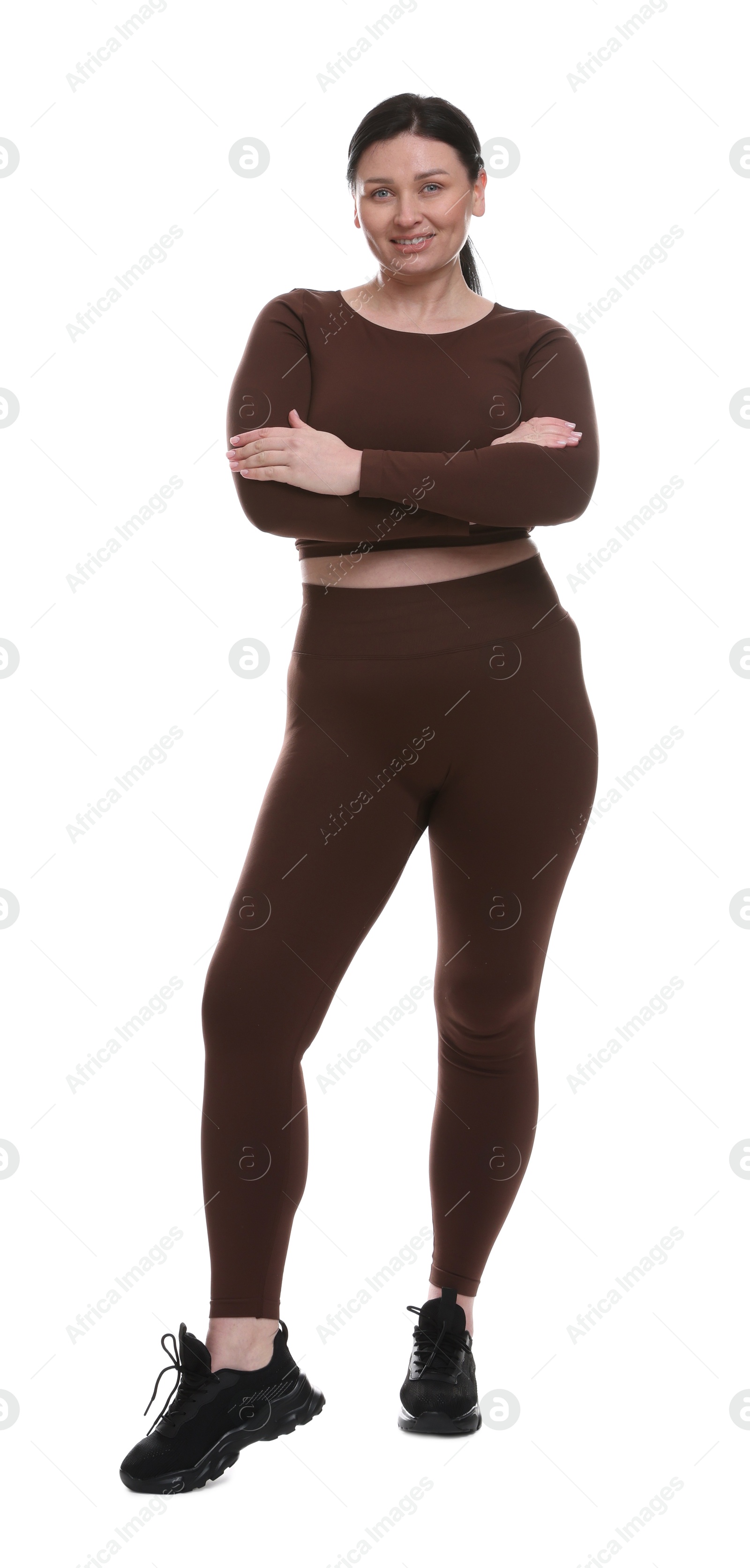 Photo of Plus size woman in gym clothes on white background