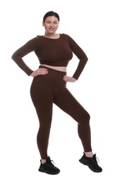 Photo of Plus size woman in gym clothes on white background