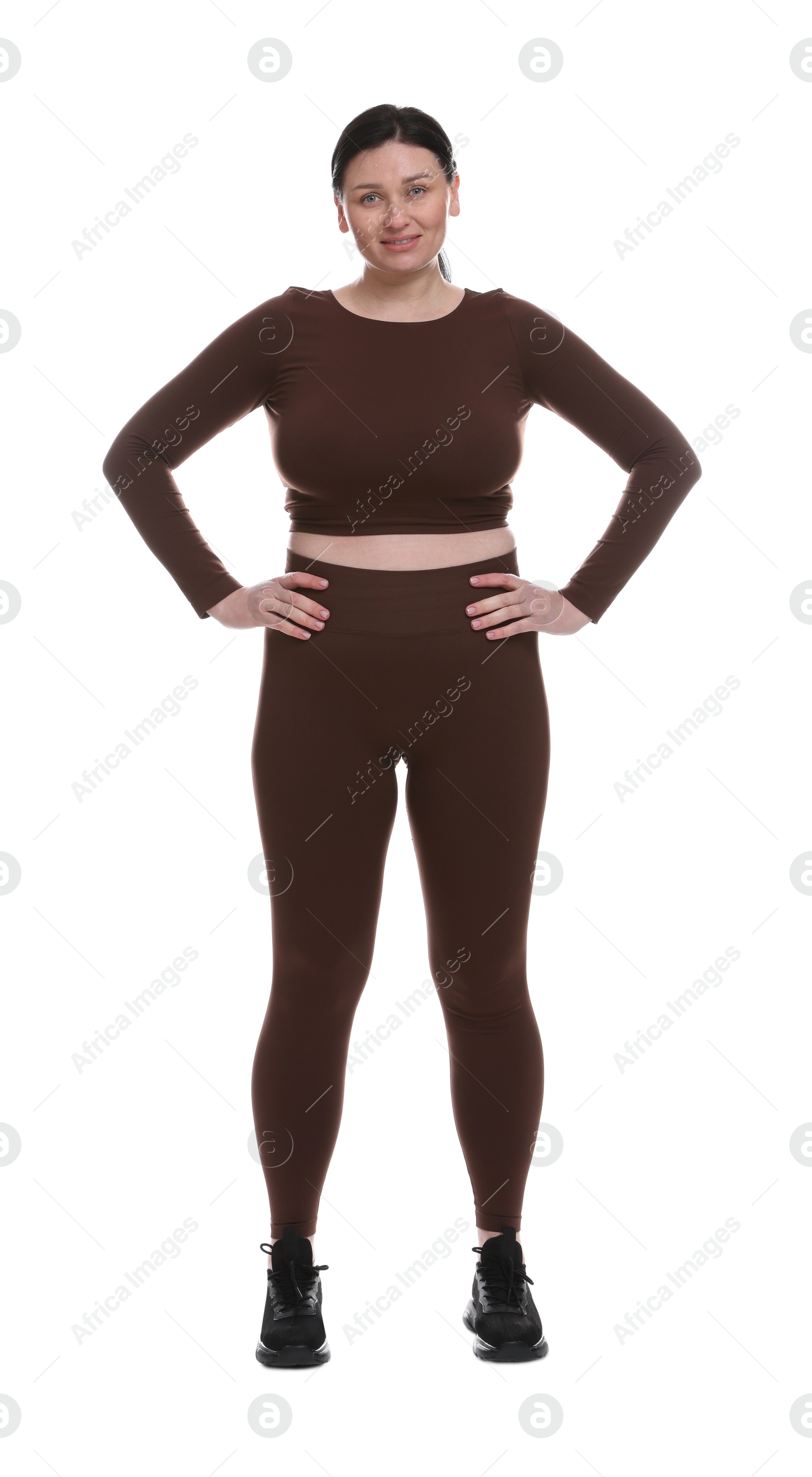 Photo of Plus size woman in gym clothes on white background