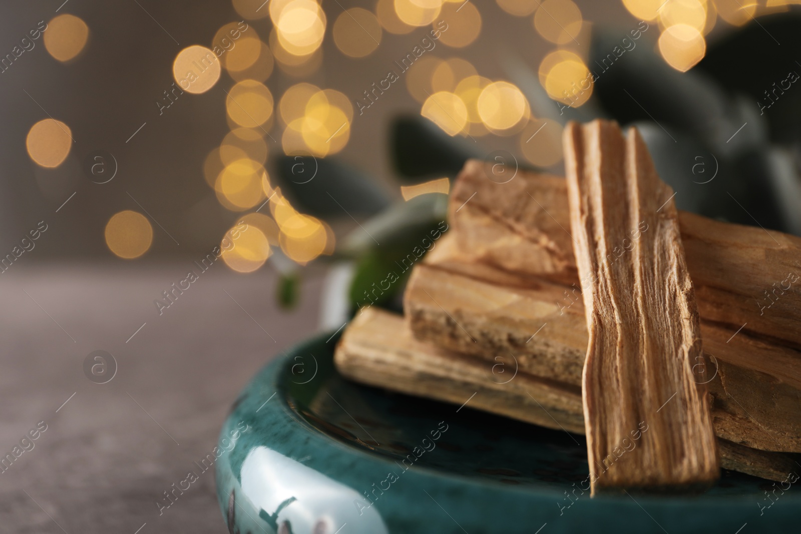 Photo of Palo santo sticks on table, closeup. Space for text