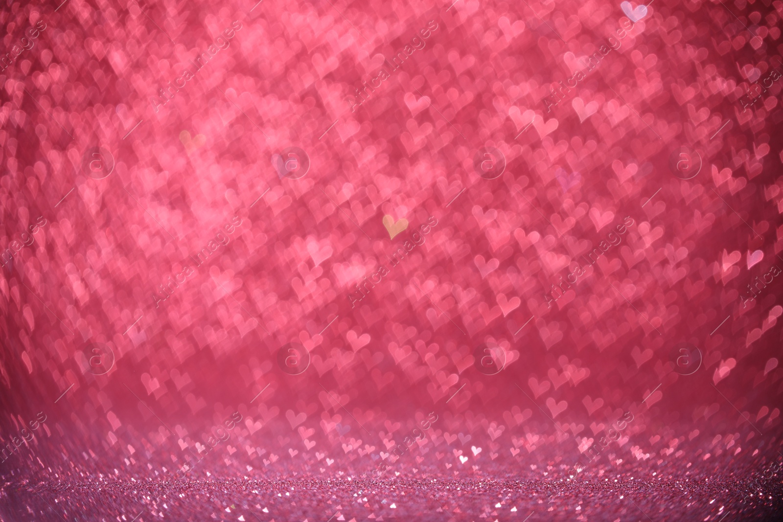 Photo of Shiny pink glitter and blurred heart shaped lights on background, bokeh effect. Romantic decor