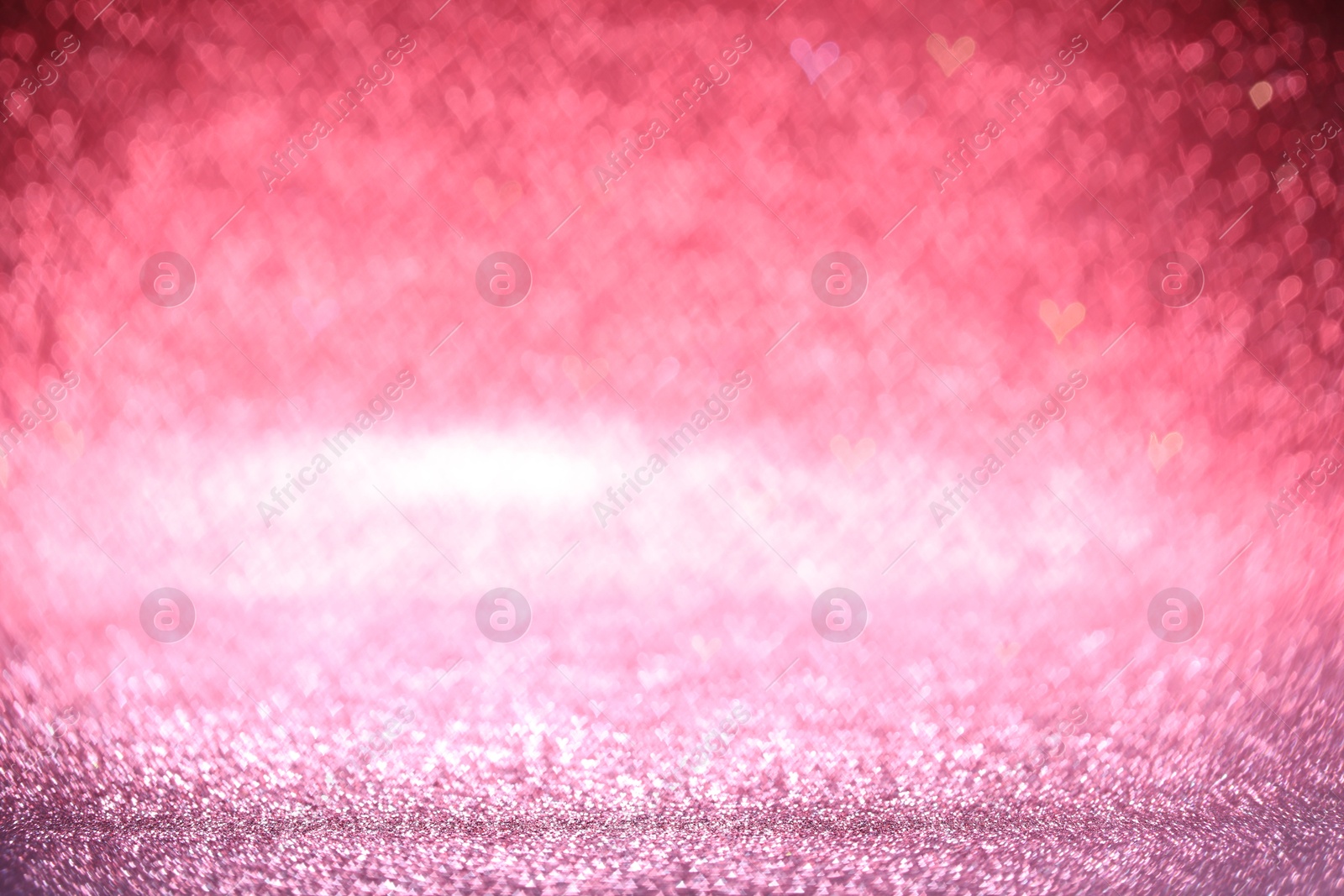 Photo of Shiny pink glitter and blurred heart shaped lights on background, bokeh effect. Romantic decor