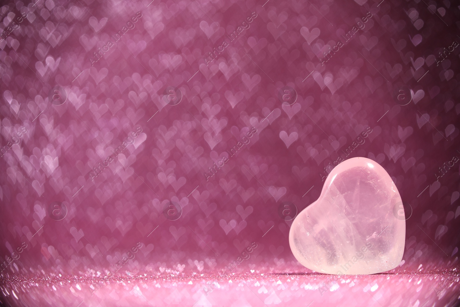 Photo of Romantic decor. Wooden heart on shiny pink glitter and bokeh lights, space for text