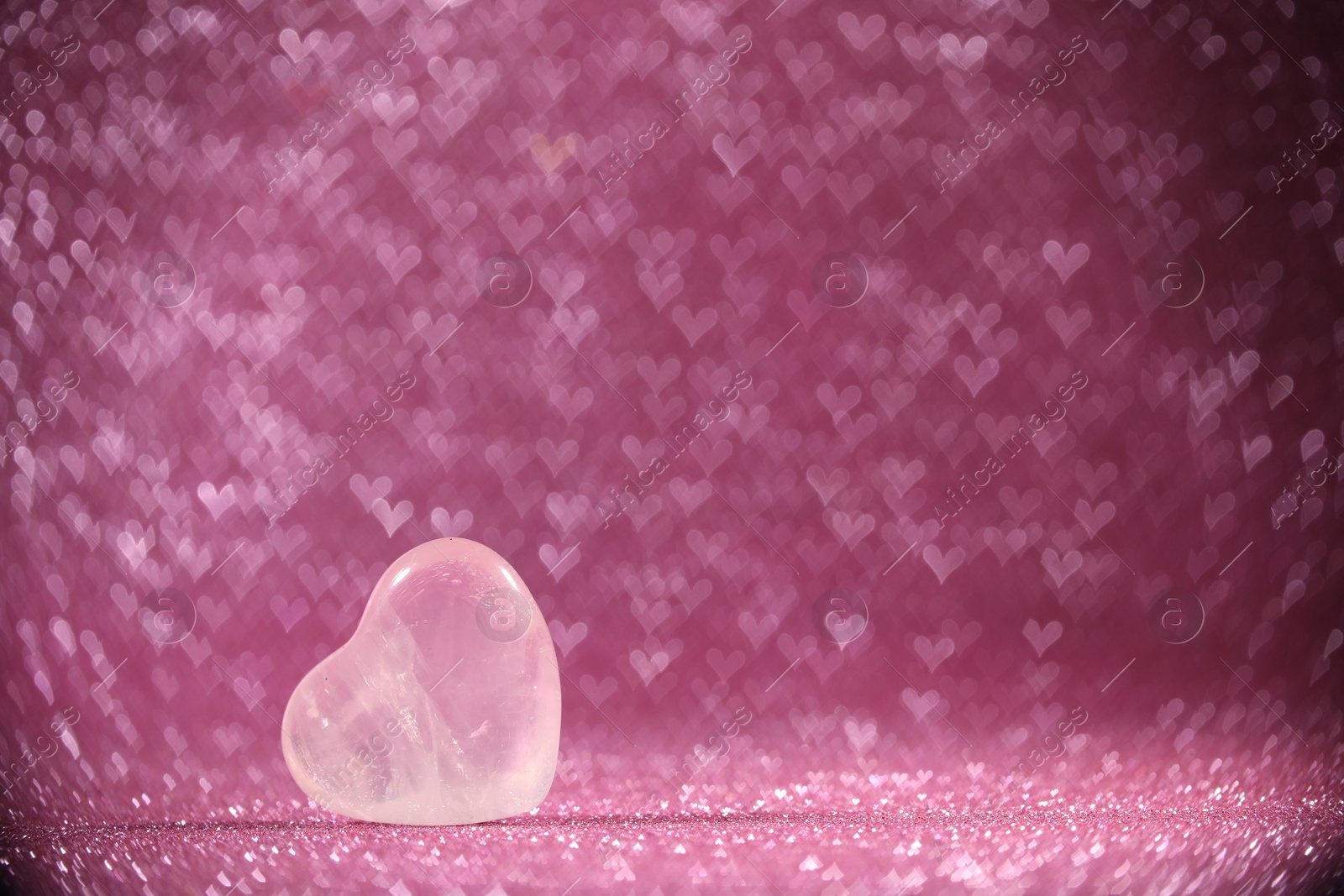 Photo of Romantic decor. Wooden heart on shiny pink glitter and bokeh lights, space for text