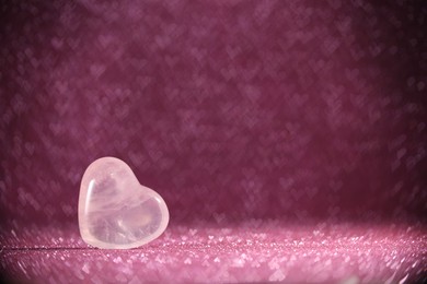 Photo of Romantic decor. Wooden heart on shiny pink glitter and bokeh lights, space for text