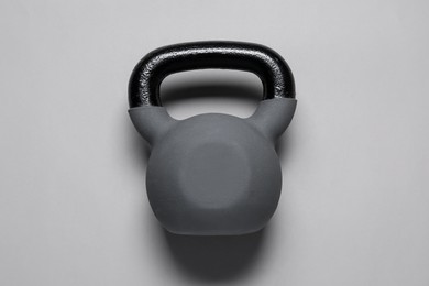 Photo of One kettlebell on light grey background, top view