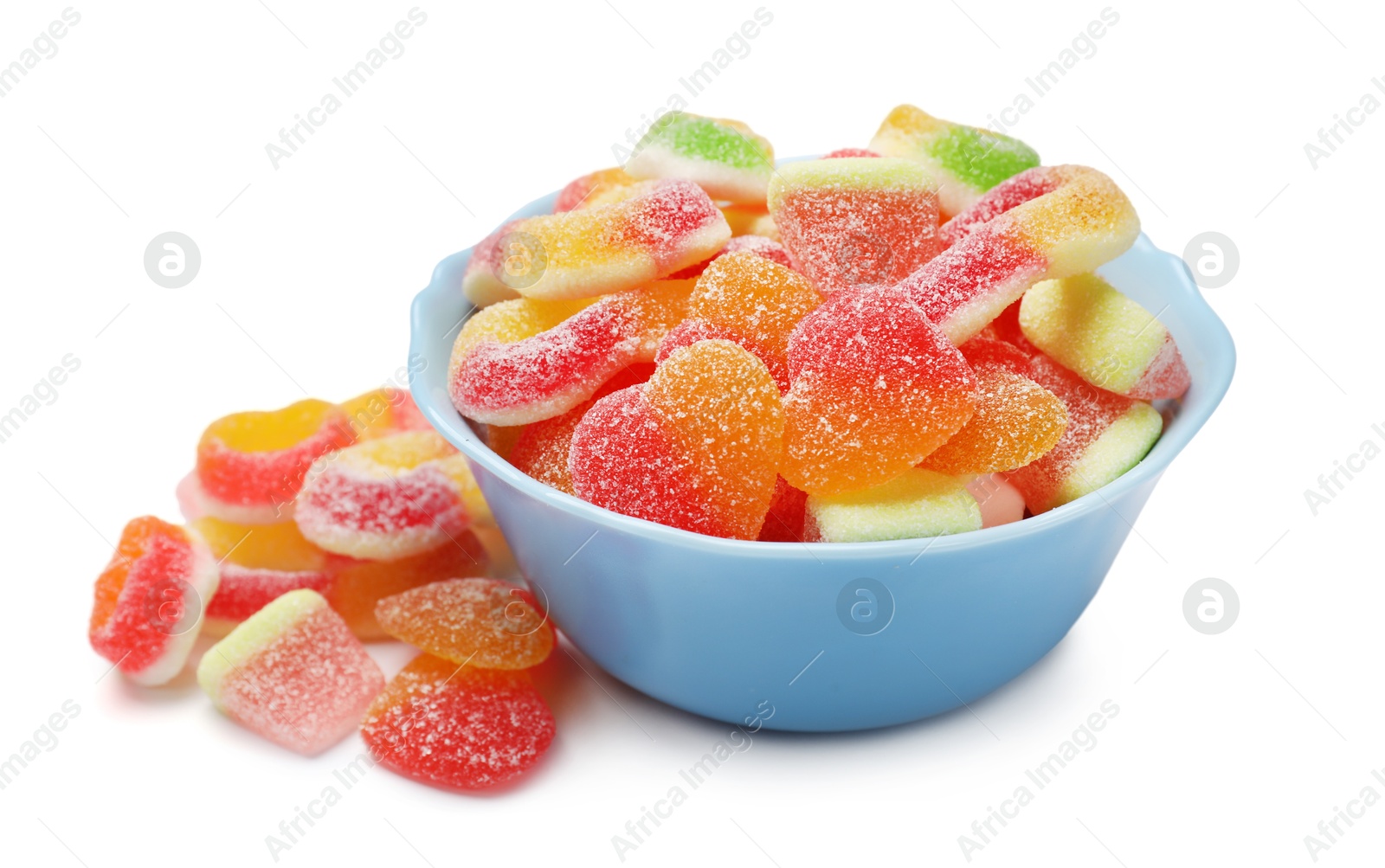 Photo of Many different tasty candies in bowl isolated on white