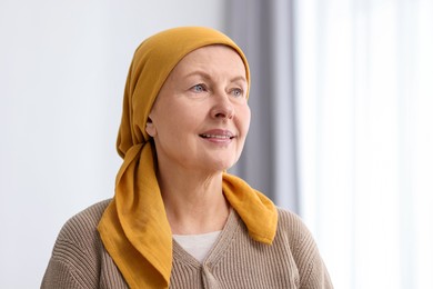 Photo of Portrait of senior woman with cancer at home