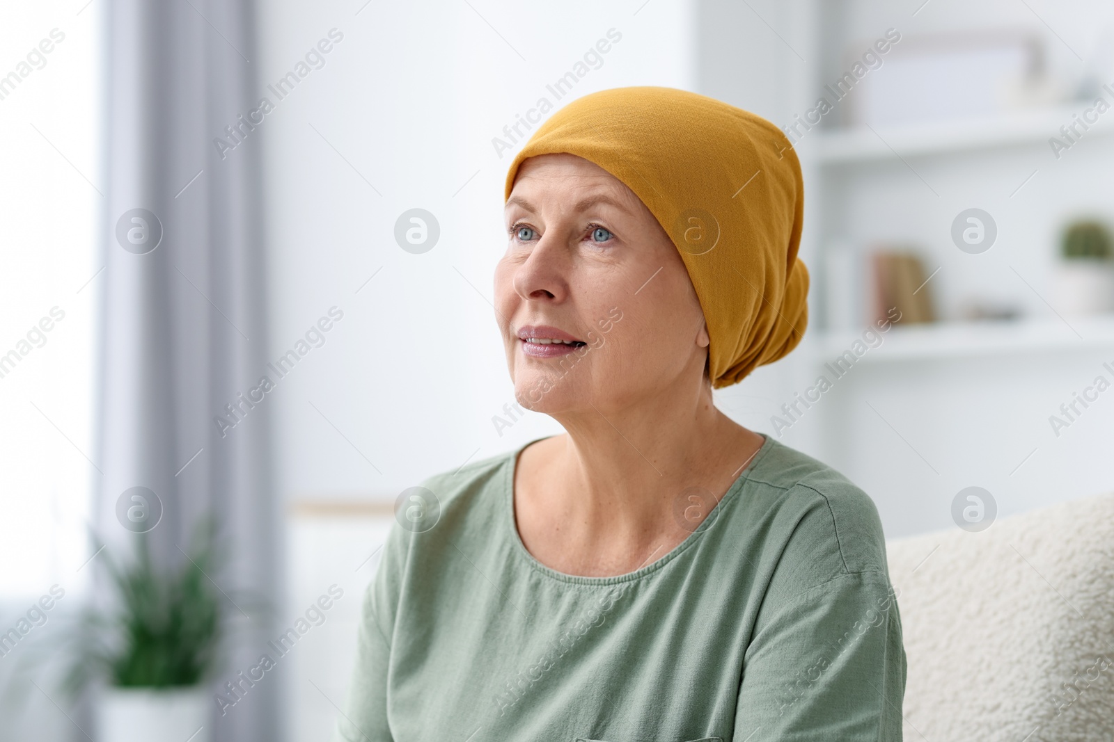 Photo of Portrait of senior woman with cancer at home