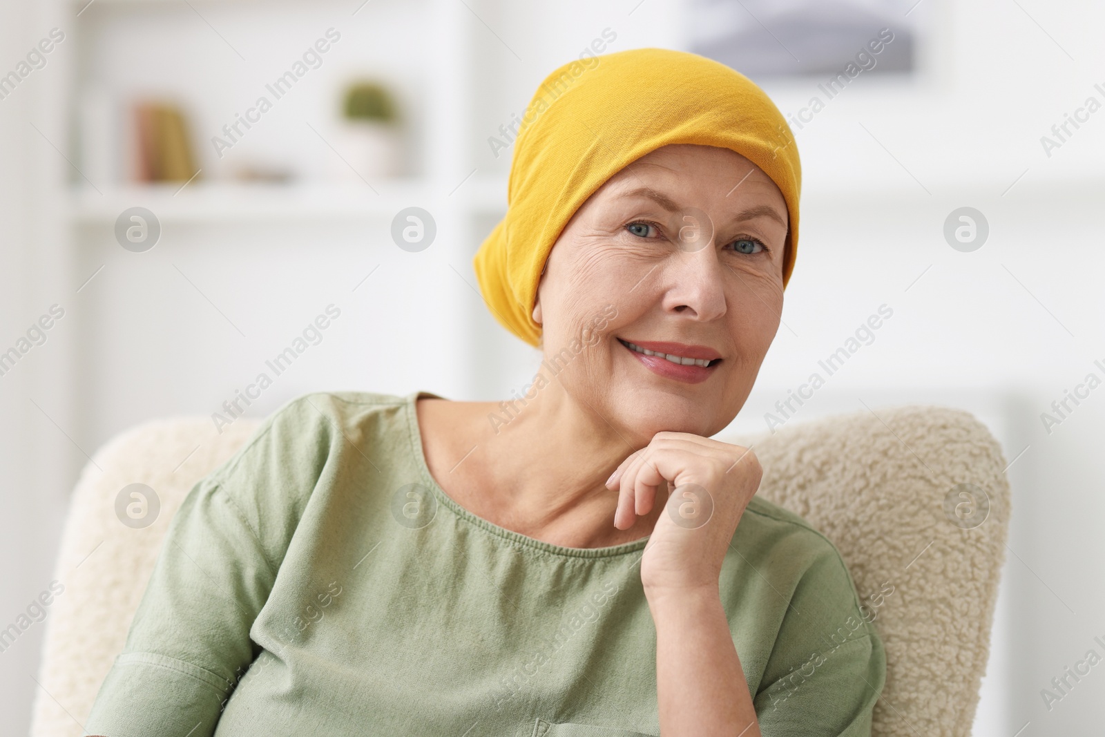 Photo of Senior woman with cancer on armchair at home