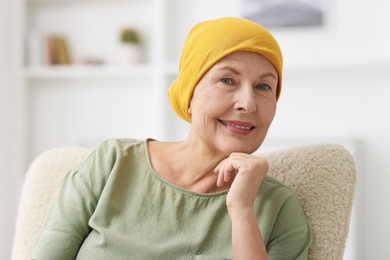 Photo of Senior woman with cancer on armchair at home