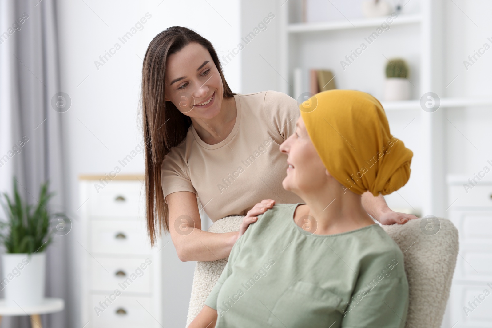 Photo of Woman with cancer and her daughter at home