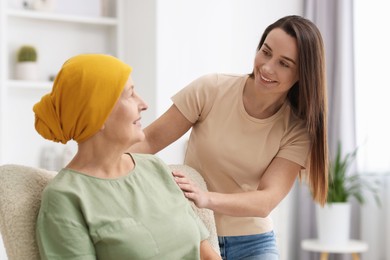 Photo of Woman with cancer and her daughter at home