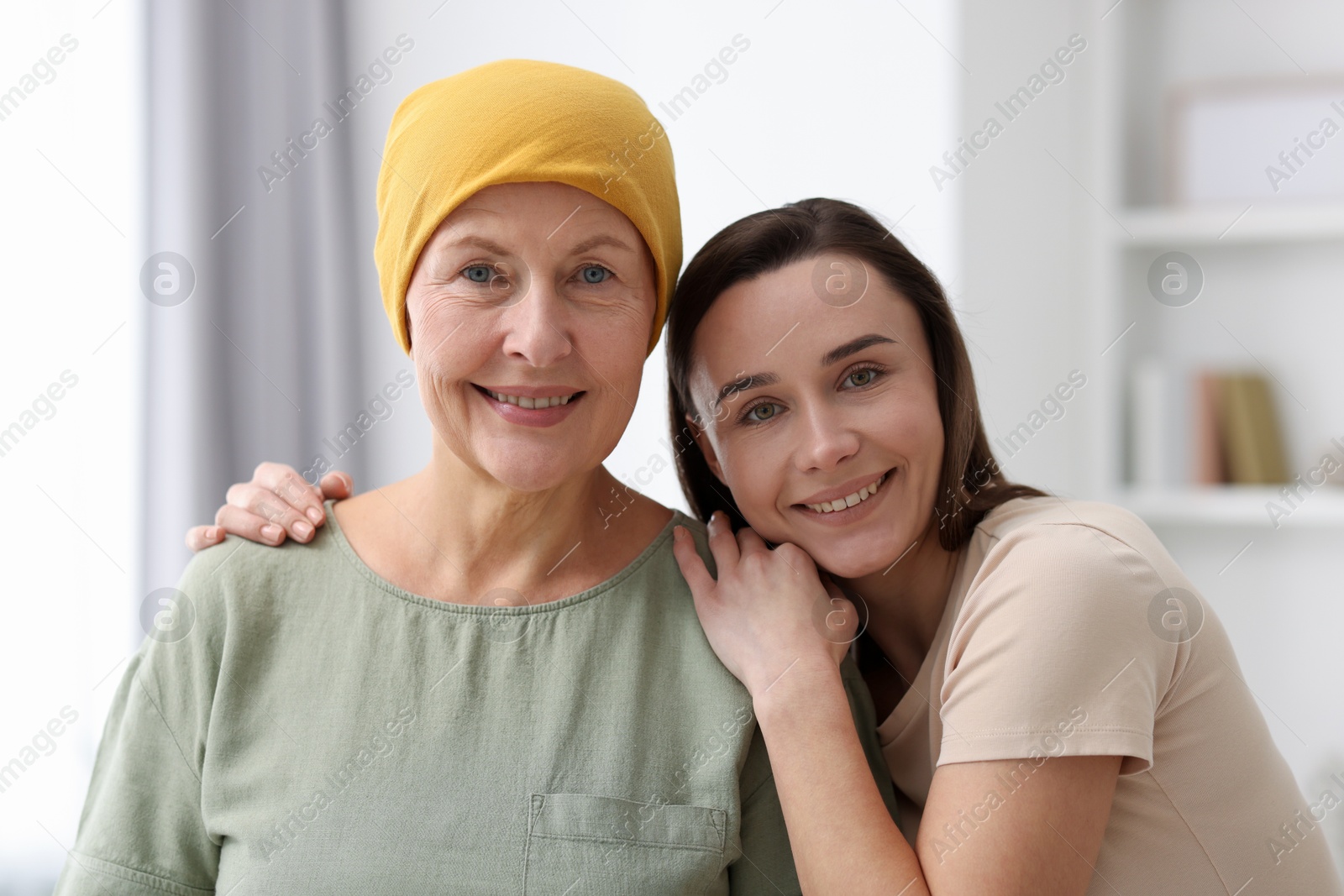 Photo of Woman with cancer and her daughter at home