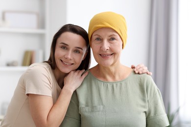 Photo of Woman with cancer and her daughter at home