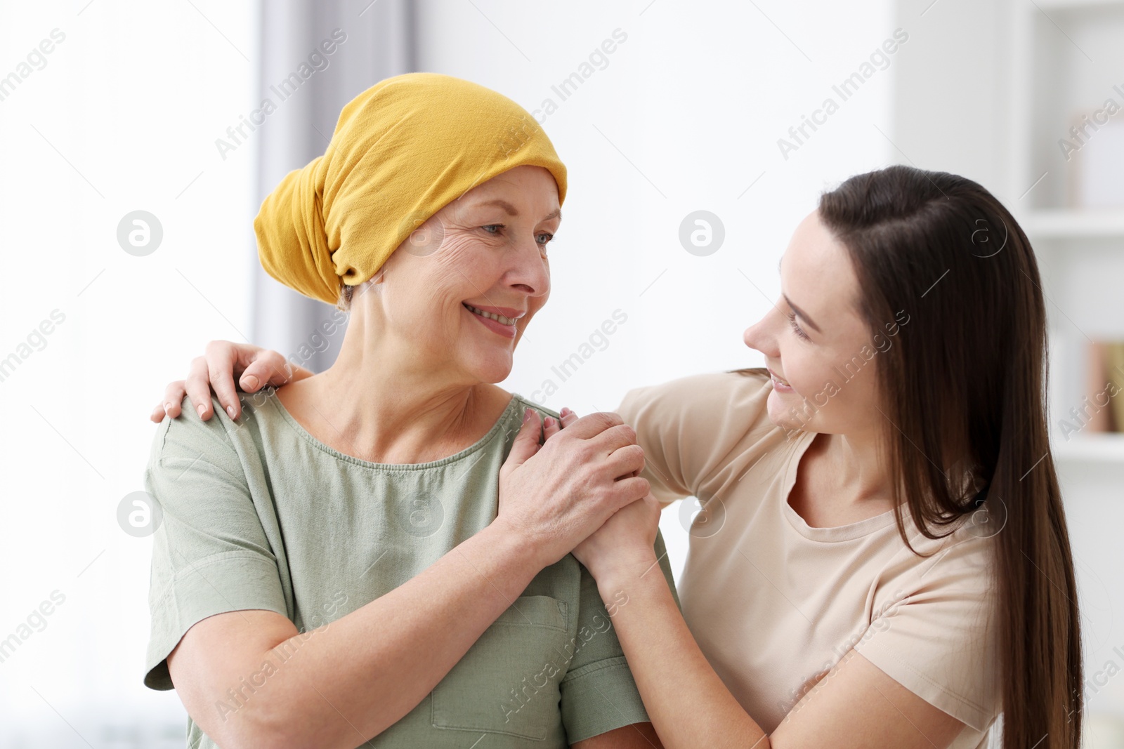 Photo of Woman with cancer and her daughter at home