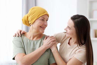 Photo of Woman with cancer and her daughter at home