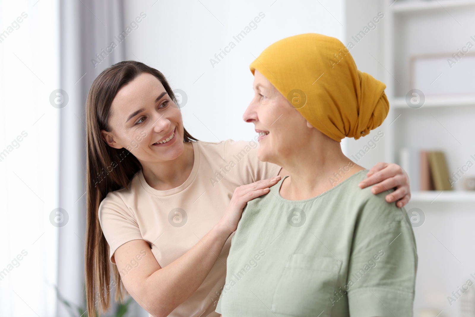 Photo of Woman with cancer and her daughter at home