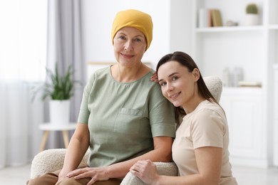 Woman with cancer and her daughter at home