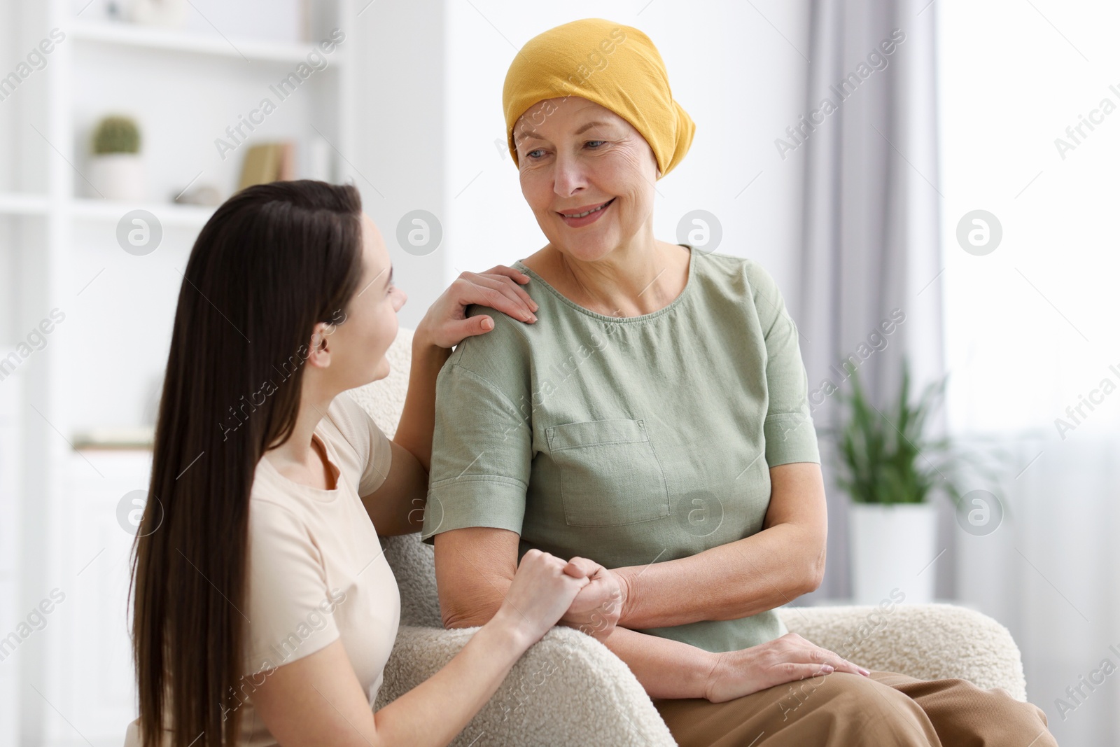 Photo of Woman with cancer and her daughter at home