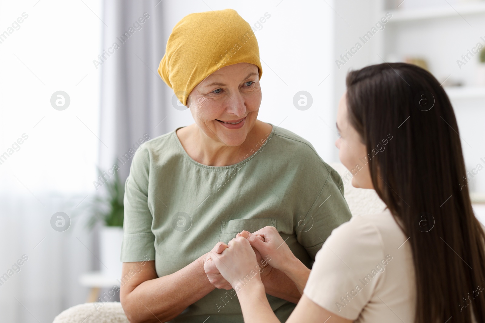 Photo of Woman with cancer and her daughter at home