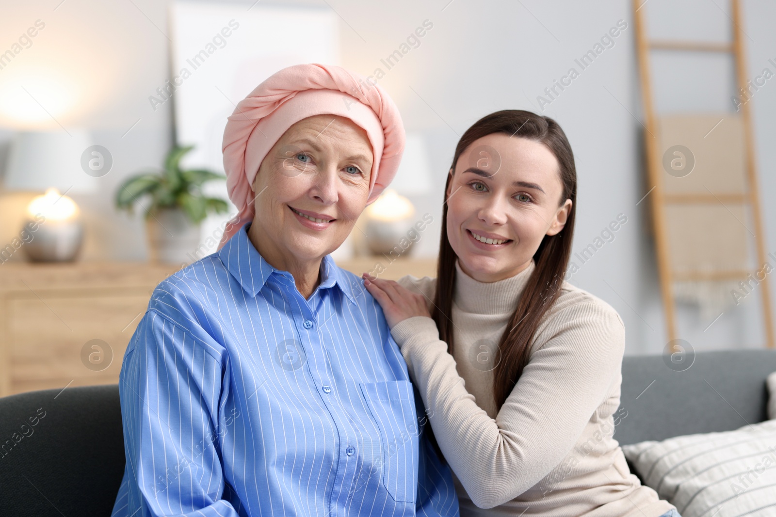 Photo of Woman with cancer and her daughter at home